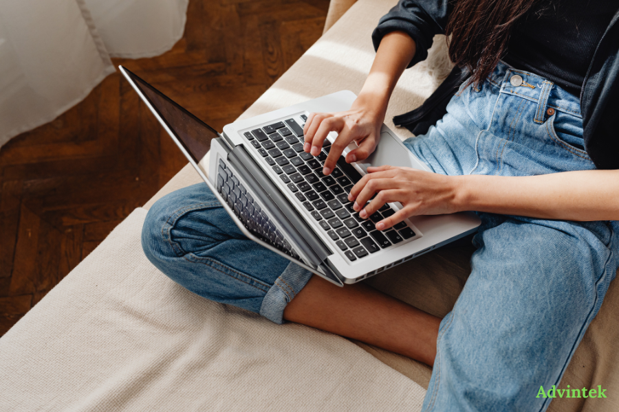 Person using laptop to manage Oman e-invoicing, VAT records, and digital finance workflows