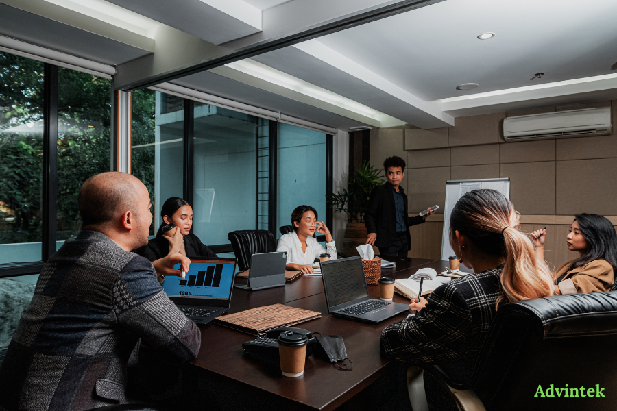 finance team discussing e-invoicing compliance and ERP integration in a boardroom