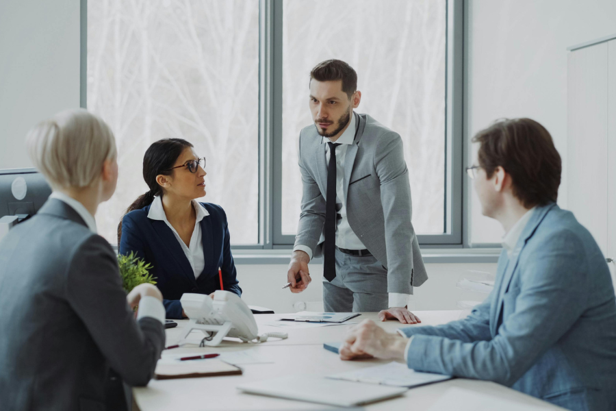 Business executives discussing strategy during a corporate boardroom meeting