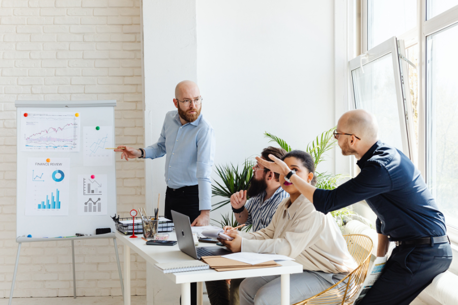 Finance team reviewing performance charts during a business planning meeting