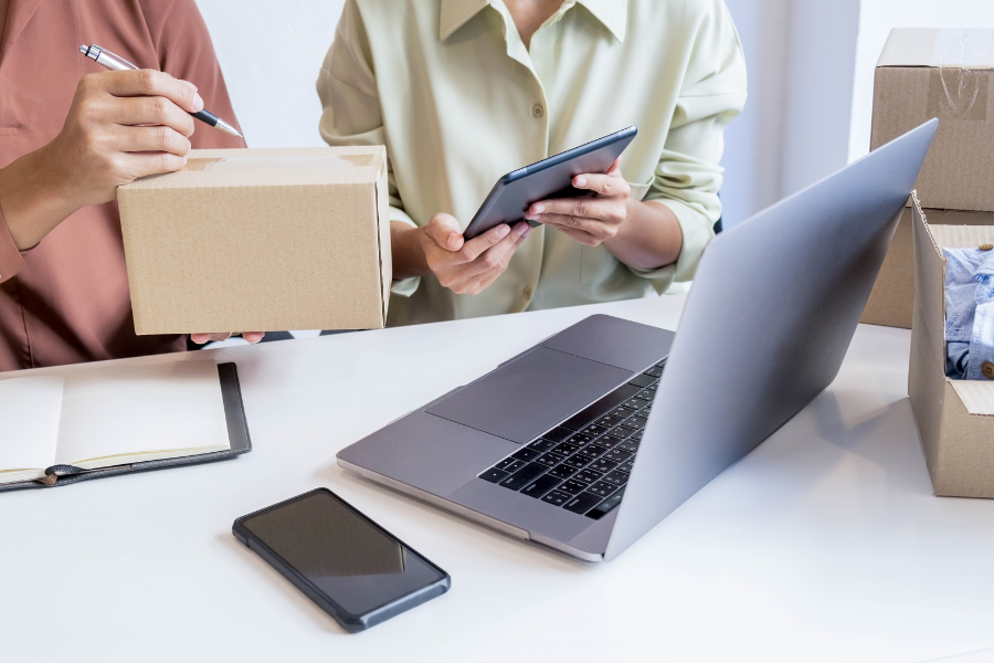 SMEs business shipping packages with laptop in front