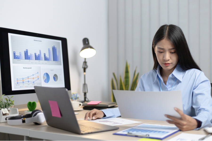 girl operating on laptop about the business