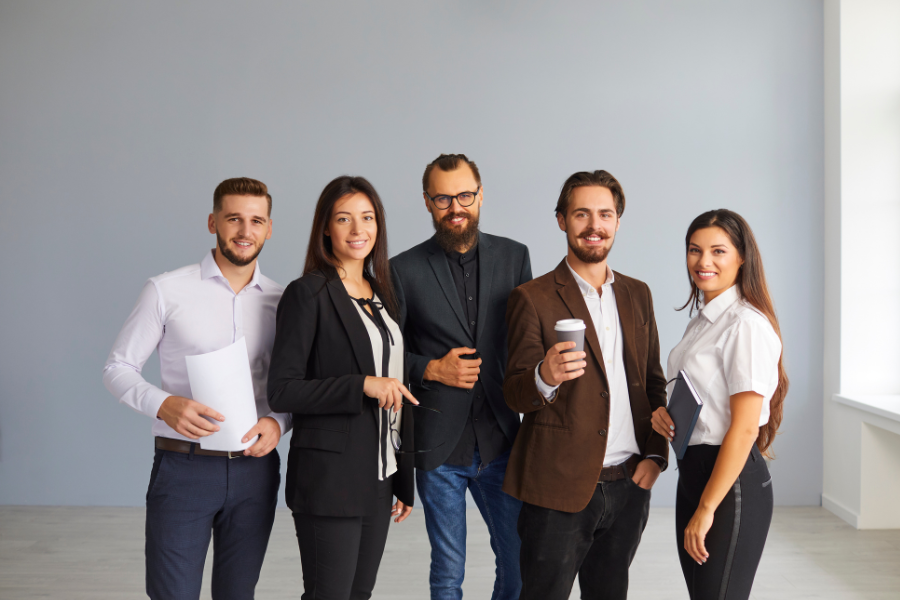 Business professionals standing together in a modern office