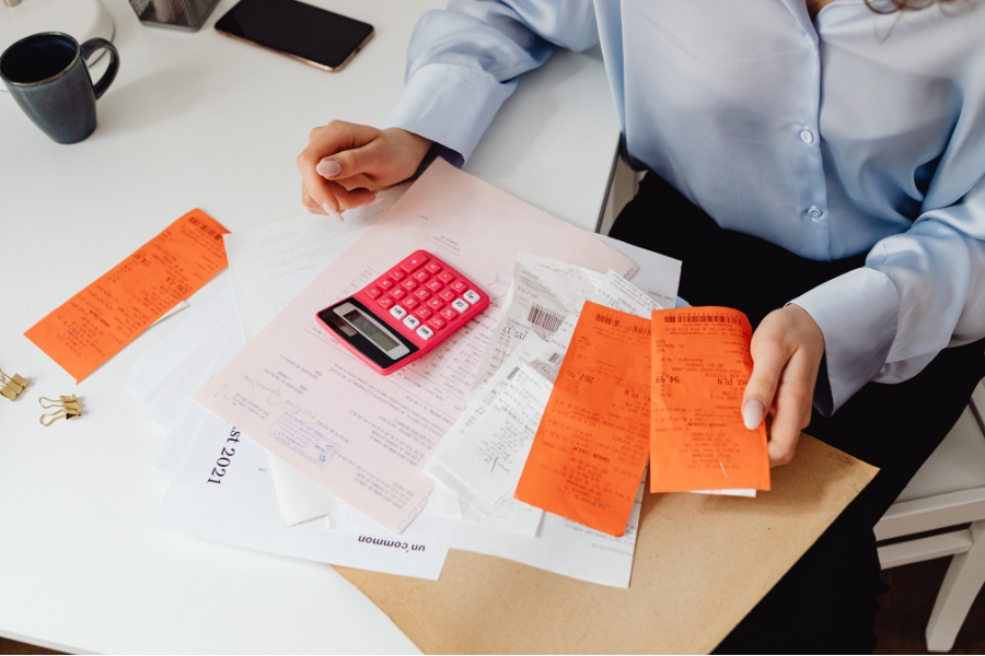 Finance professional reviewing invoices and receipts for Oman e-invoicing compliance