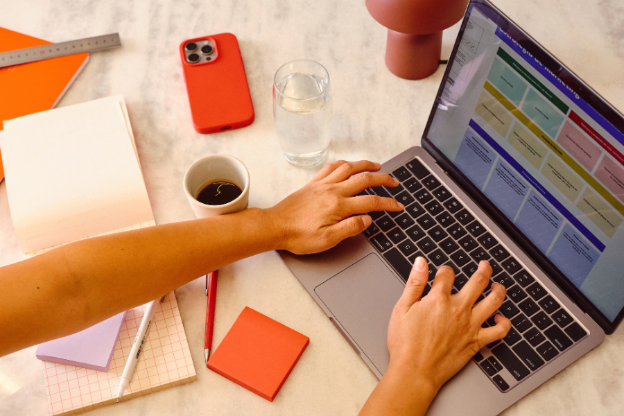 Finance professional reviewing Fawtara compliance software dashboard on laptop